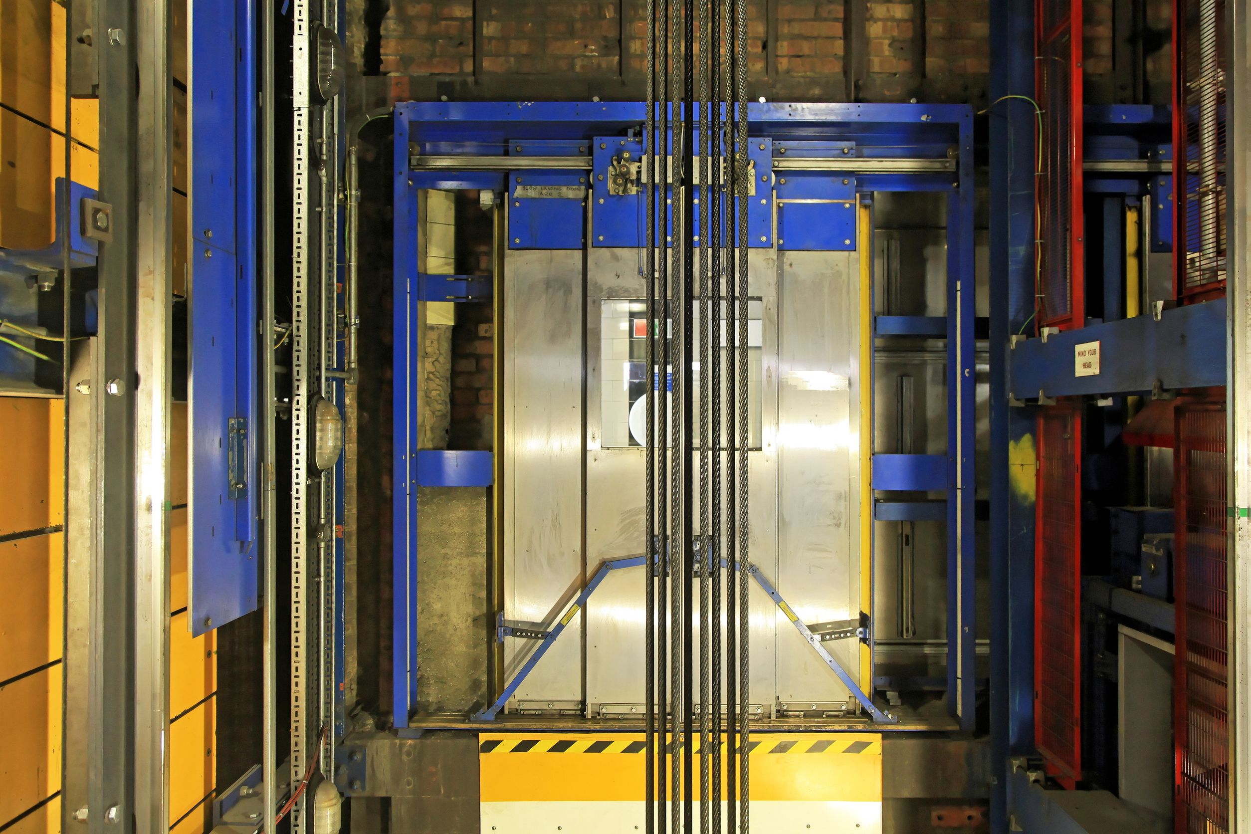 14473886 Modern Elevator Shaft Interior With Cables And Tracks